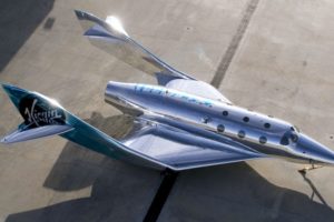 A photo of the silver Virgin galactic plane.