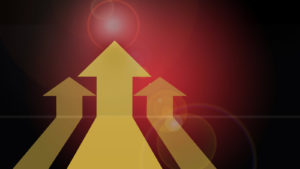 An image of three yellow arrows on a red background.
