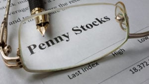 Page of newspaper with words penny stocks.