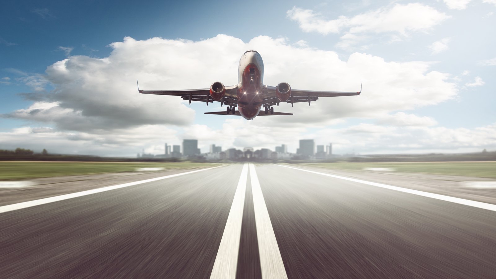 a jet takes off on a clear runway, airline stocks