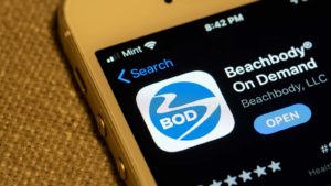 The Beachbody (BODY) app is displayed on an iPhone screen.