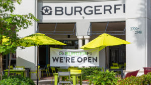 A photo of the exterior of a Burgerfi (BFI) restaurant.