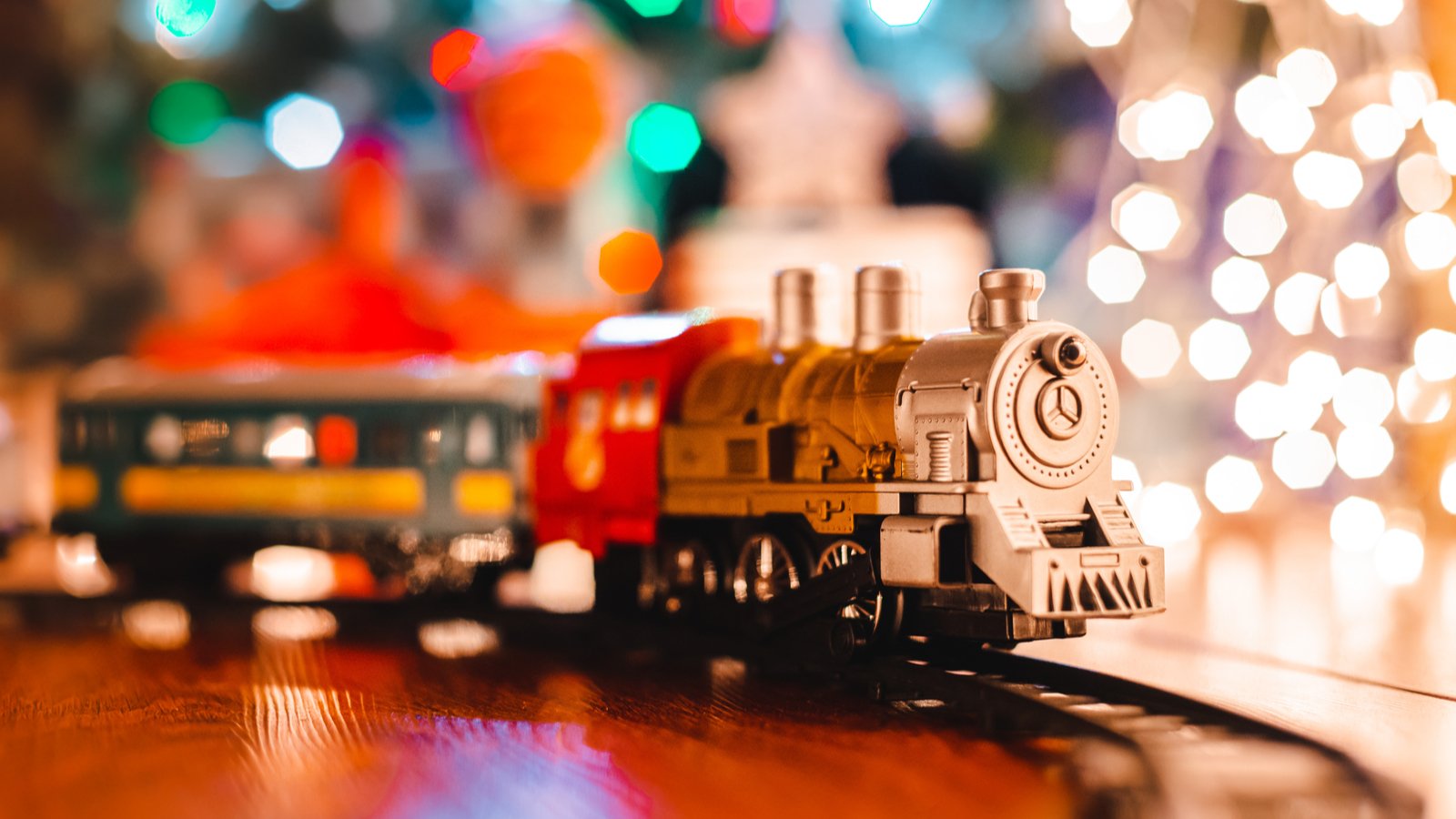 Is the Stock Market Closed on Christmas. A toy train in front of a Christmas tree.