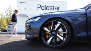 A close up of a Polestar (GGPI stock) vehicle in front of a company sign.