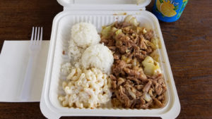 A photo of a Hawaiian lunch plate in a to-go container.