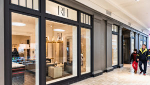 The storefront to an RH retail location is seen inside a shopping mall.