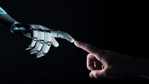a robotic hand reaching out to a human hand on a black background, with pointing fingers touching