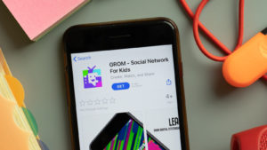 GROM stock: a phone displaying the GROM social network app page in the app store