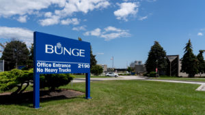 A Photo of a blue sign in an industrial campus showing the Bunge (BG) logo. Plant-based food stocks