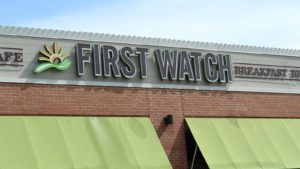 A close-up shot of the awning of a First Watch (FWRG) restaurant in University Park, Florida.