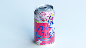 A photograph of an unopened can of passionfruit-flavored La Croix.