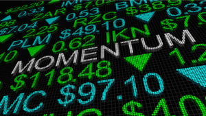A concept image of a board with stock prices with the word "momentum" in the middle.