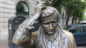 A bronze statue of fictional detective Columbo, as portrayed by Peter Falk.
