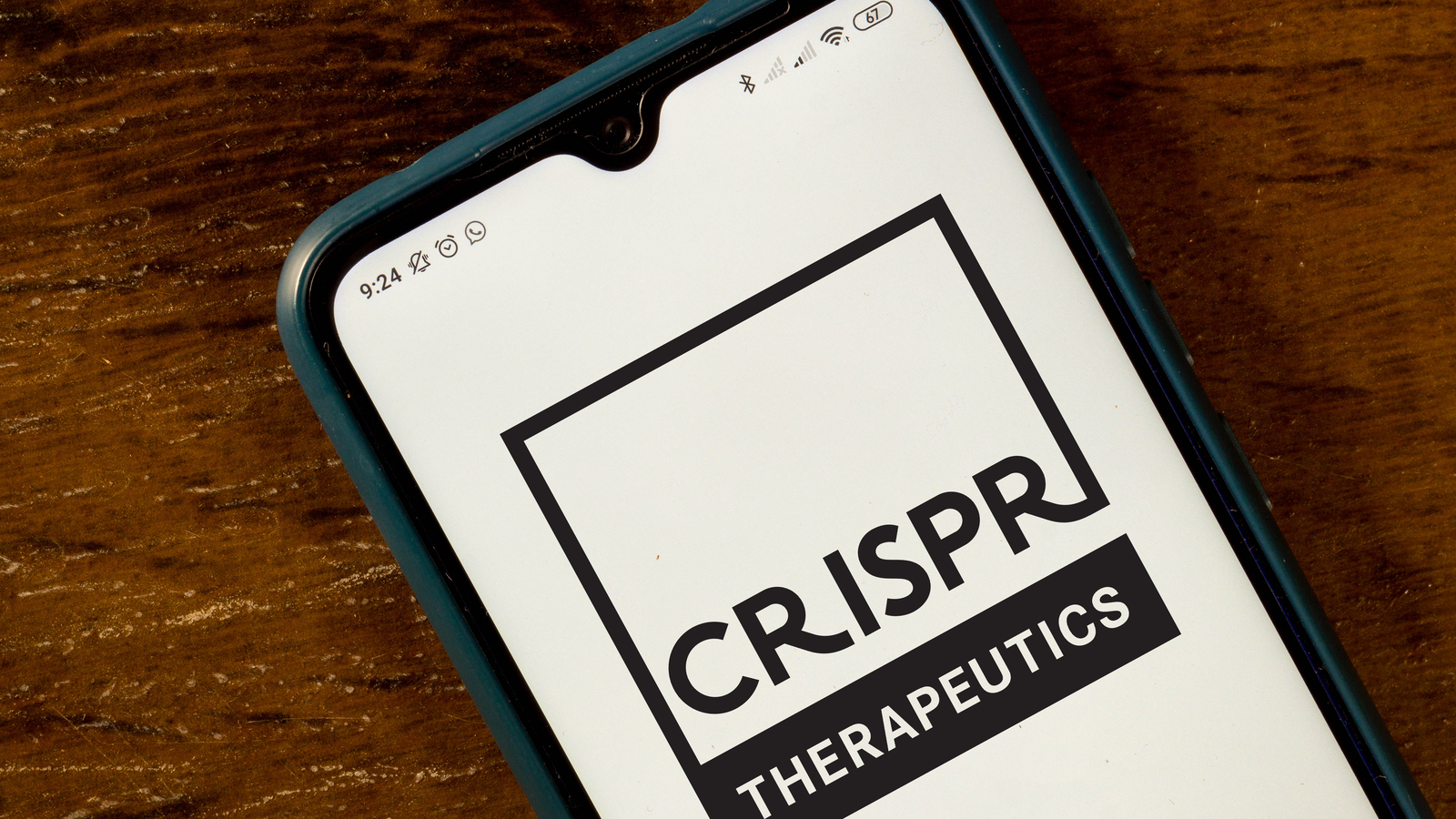 the CRISPR Therapeutics logo seen displayed on a smartphone, CRSP Stock.