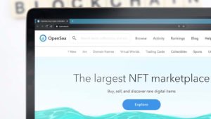 The website for OpenSea is displayed on a laptop screen.