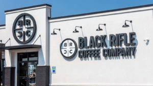 An exterior of a Black Rifle Coffee Company (SBEA) store. 