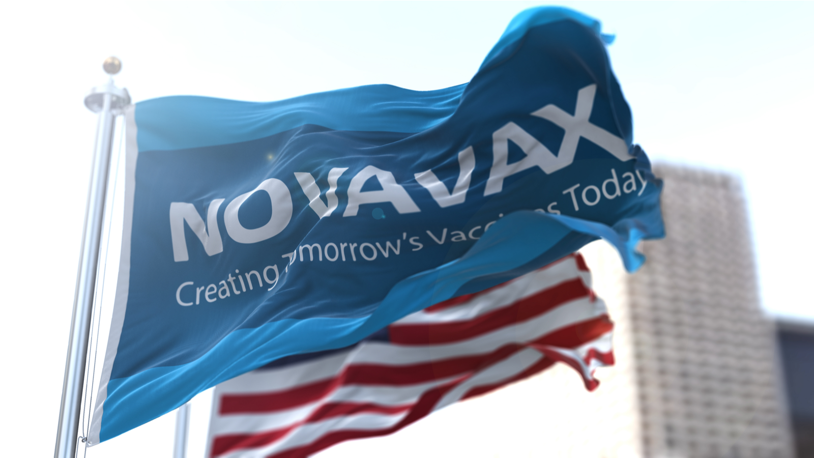 Flag with the Novavax (NVAX) logo waving in the wind with the American flag in the background