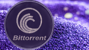 A BitTorrent (BTT) crypto token on a purple fabric background.