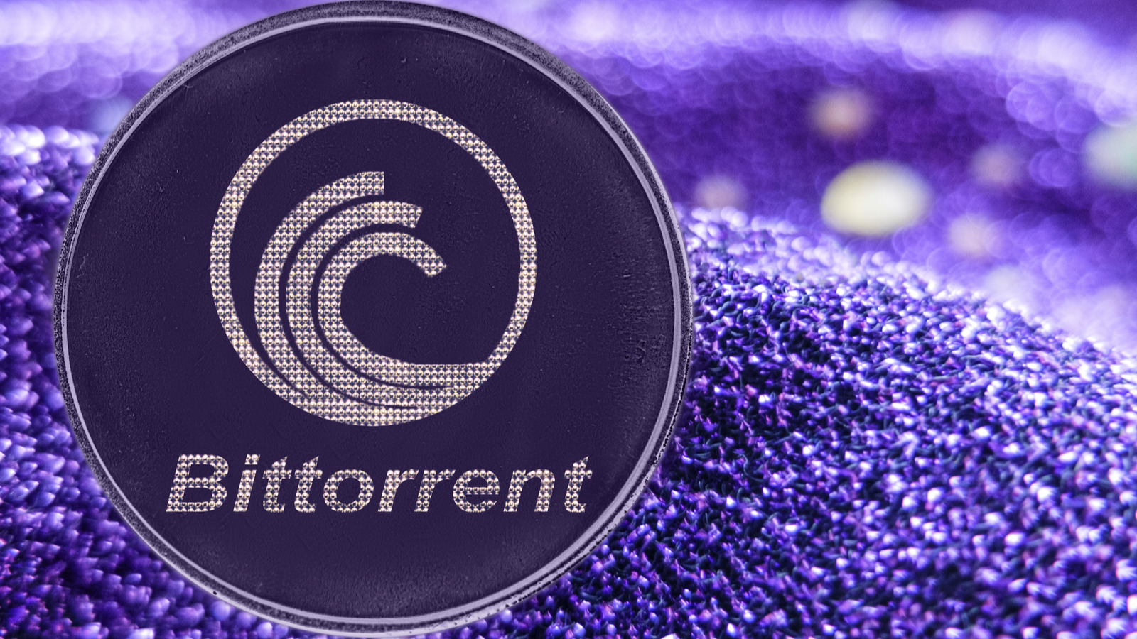 A BitTorrent (BitTorrent Price Predictions) crypto token on a purple fabric background.