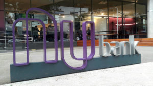 Nubank sign outside an office building.