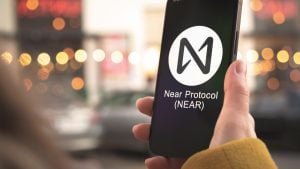 NEAR Protocol (NEAR-USD) logo on a smartphone held in person's hand