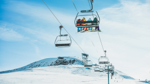 People on ski lift in winter ski resort