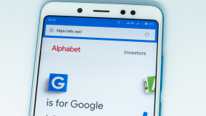 Logo of Alphabet (GOOG) website displayed on the screen of the mobile device. alphabet logo visible on display of modern smartphone on white