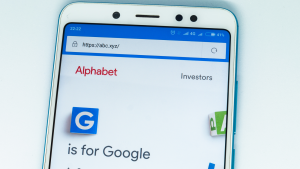 Logo of Alphabet (GOOGL) website displayed on the screen of the mobile device. alphabet logo visible on display of modern smartphone on white