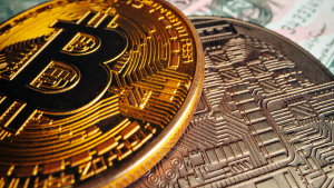 Bitcoin (BTC-USD) on american dollar banknote close up, Marathon Digital (MARA) is a major bitcoin miner. ABIT Stock