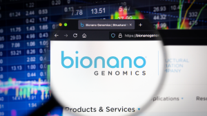 Bionano Genomics (BNGO) company logo on a website with blurry stock market developments in the background. multibagger stocks