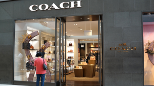 A photo of a Coach retail store. Coach is one of the brands owned by Tapestry (TPR).