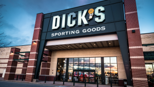 Exterior view of Dick's Sporting Goods retail store with sign and logo.