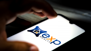 In this photo illustration the eXp Realty International Corporation (EXPI) logo seen displayed on a smartphone