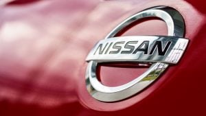Closeup emblem nissan automobile with soft-level of interest and over gentle within the background