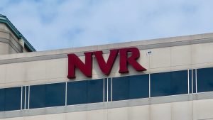 The logo for NVR is seen on the top of an office building.