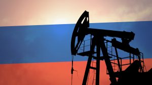 An oil pump with the Russian flag in the background representing Why Are Stocks Down Today.