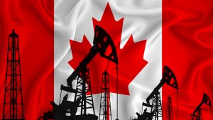 Canadian oil stocks: Silhouette of drilling rigs and oil derricks on the background of the flag of Canada.