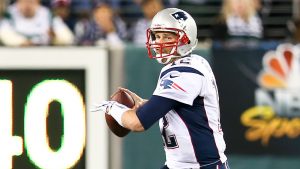 Tom Brady preparing to throw a football.