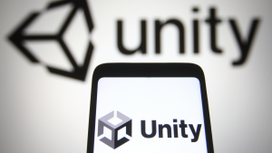 Sur Cette Photo, Le Logo Unity Software Inc. (Stock U) Est Visible Sur Un Téléphone Mobile Et Un Écran D'Ordinateur.