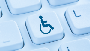 A concept image of the International Symbol of Access on a key on a computer keyboard.