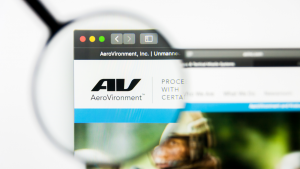 The logo for AeroVironment (AVAV) is seen through a magnifying glass on the company's website.