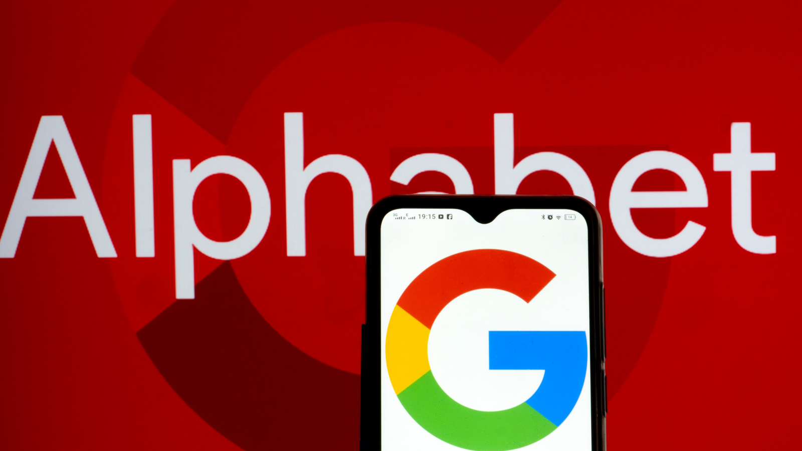 Alphabet Inc. (GOOG, GOOGL) and Google logos seen displayed on a smartphone representing tech stocks.