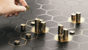 Human hand stacking coins over a black background with hexagonal golden shapes. Concept of investment management and portfolio diversification. Composite image between a hand photography and a 3D back, ETFs