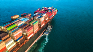 Aerial scrutinize container ship switch import export logistic and transportation of world by container cargo ship in the delivery sea, Marine cargo freight shipping.