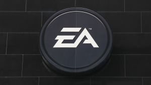 EA games logo on a black brick background. EA stock.