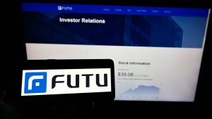 An iPhone screen displaying the Futu Holdings logo.