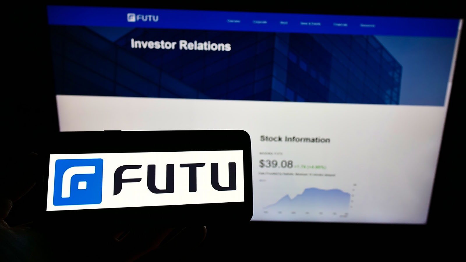 An iPhone screen displaying the Futu Holdings logo futu stock.