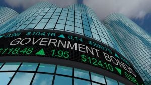 Government Bonds is displayed on a Wall Street stock ticker.