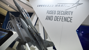 An F-16 and an F-35 model at the background, at the Lockheed Martin exhibition stand in Thessaloniki International Fair.