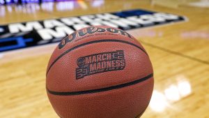 A close-up shot of a March Madness-branded basketball.